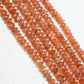 【250027】サンストーンボタンカット2~6mm x 6~7.5mm（1連19cm）